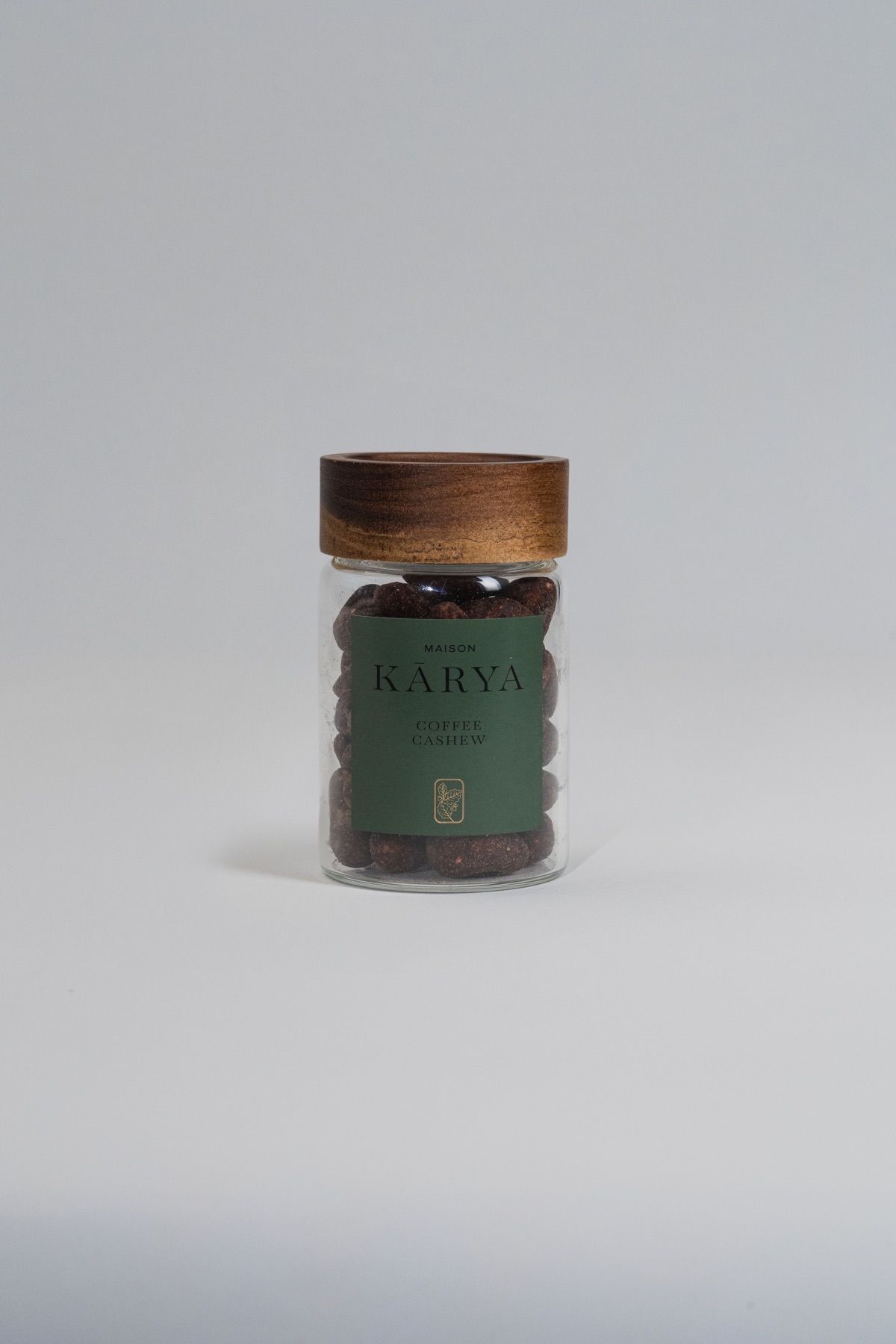 Plain-screen source photograph of a coffee cashew jar